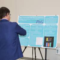 people standing around a senior project